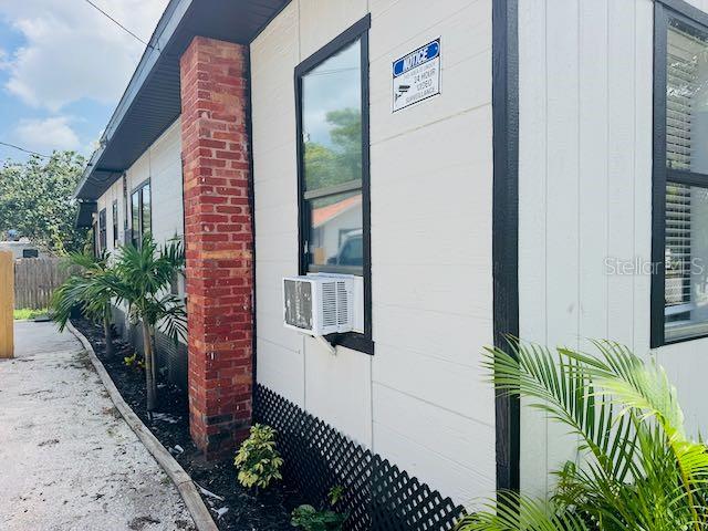 1412 12th Ave W, Bradenton, FL 34205 - view of side of home with cooling unit