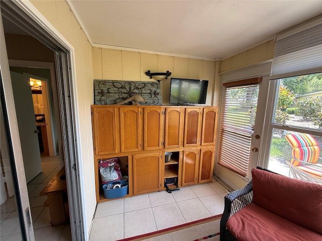 390 301st Blvd W Unit 2C, Bradenton, FL 34205 - living area with light tile patterned floors and crown molding