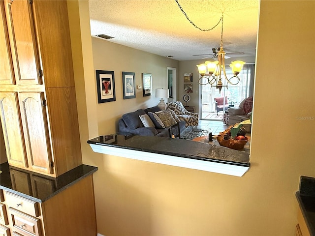 390 301st Blvd W Unit 2C, Bradenton, FL 34205 - living room with a textured ceiling and ceiling fan