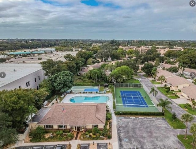 390 301st Blvd W Unit 2C, Bradenton, FL 34205 - aerial view of a pool area and a tree filled landscape