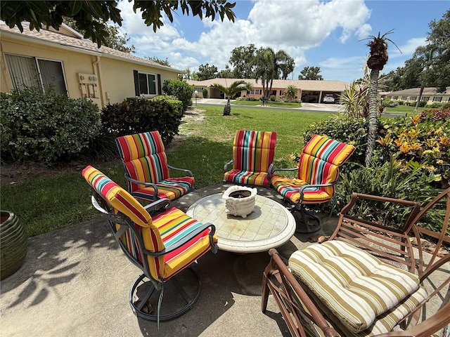390 301st Blvd W Unit 2C, Bradenton, FL 34205 - view of patio / terrace with a fire pit