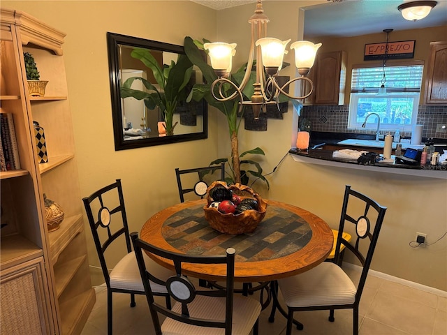390 301st Blvd W Unit 2C, Bradenton, FL 34205 - dining area with light tile patterned flooring and a chandelier
