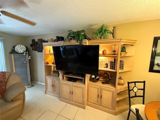 390 301st Blvd W Unit 2C, Bradenton, FL 34205 - living area with a textured ceiling and light tile patterned floors