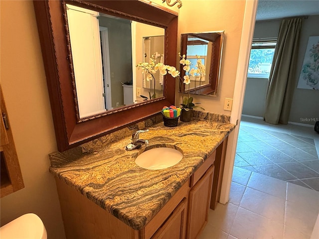 390 301st Blvd W Unit 2C, Bradenton, FL 34205 - bathroom with vanity and tile patterned flooring