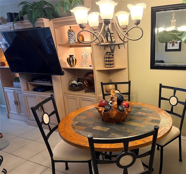 390 301st Blvd W Unit 2C, Bradenton, FL 34205 - dining area with a chandelier and light tile patterned flooring