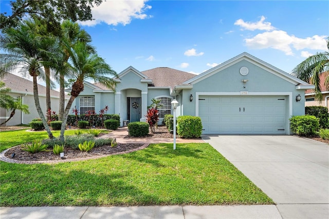 6750 64th Ter E, Bradenton, FL 34203 - ranch-style home featuring stucco siding, a garage, driveway, and a front lawn