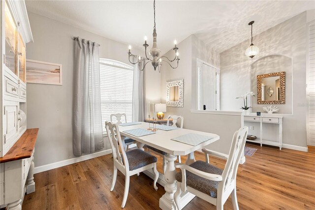 6750 64th Ter E, Bradenton, FL 34203 - dining area with a chandelier and wood finished floors