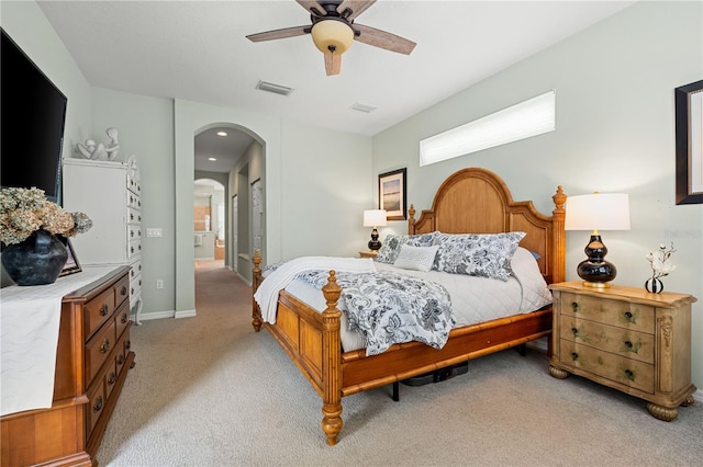 6750 64th Ter E, Bradenton, FL 34203 - bedroom featuring light colored carpet, arched walkways, a closet, a ceiling fan, and recessed lighting
