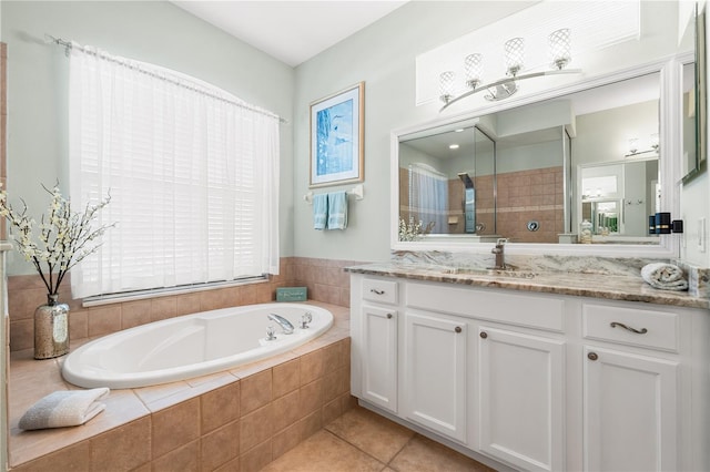 6750 64th Ter E, Bradenton, FL 34203 - full bathroom with vanity, a bath, tile patterned flooring, and healthy amount of natural light