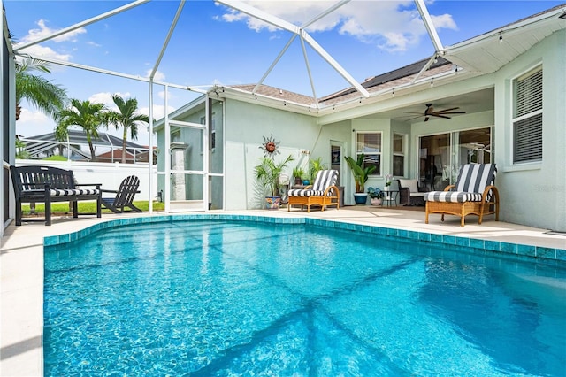 6750 64th Ter E, Bradenton, FL 34203 - outdoor pool with a patio, glass enclosure, a ceiling fan, and outdoor lounge area