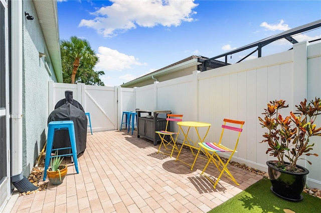 6750 64th Ter E, Bradenton, FL 34203 - fenced backyard featuring a gate and a patio area