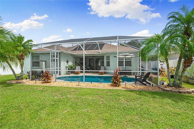 6750 64th Ter E, Bradenton, FL 34203 - back of property with a yard, stucco siding, an outdoor pool, and a patio area