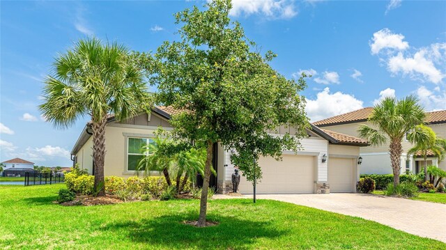3504 Big Sky Way, Bradenton, FL 34211 - view of front of home with a garage, driveway, and a tile roof