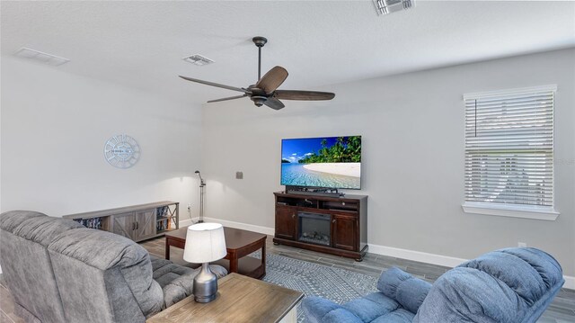 3504 Big Sky Way, Bradenton, FL 34211 - living area with baseboards, wood finished floors, and ceiling fan