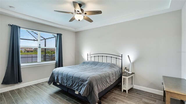 3504 Big Sky Way, Bradenton, FL 34211 - bedroom with wood finished floors, baseboards, and ceiling fan