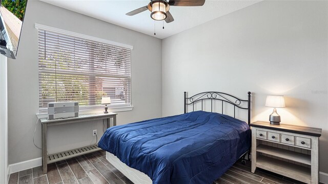 3504 Big Sky Way, Bradenton, FL 34211 - bedroom with wood finish floors, baseboards, and a ceiling fan
