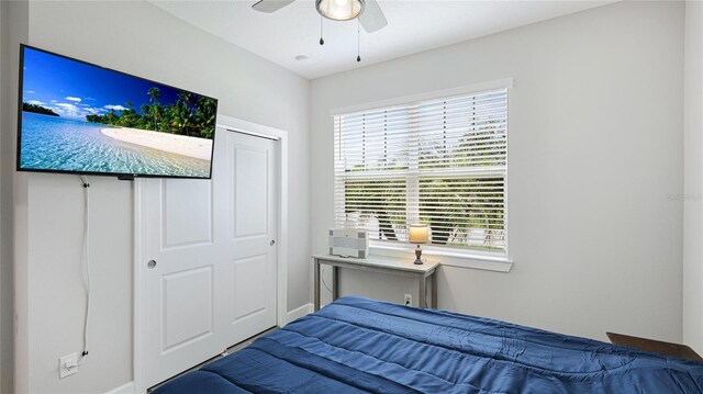 3504 Big Sky Way, Bradenton, FL 34211 - bedroom with multiple windows, baseboards, and a ceiling fan