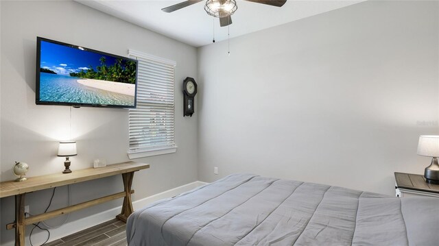 3504 Big Sky Way, Bradenton, FL 34211 - bedroom with dark wood-style floors, baseboards, multiple windows, and ceiling fan