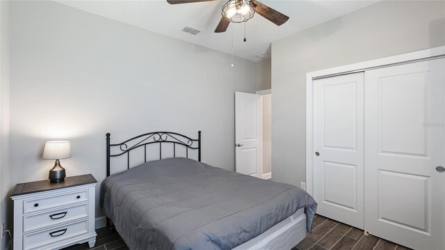 3504 Big Sky Way, Bradenton, FL 34211 - bedroom featuring wood tiled floors, a closet, ceiling fan, and baseboards