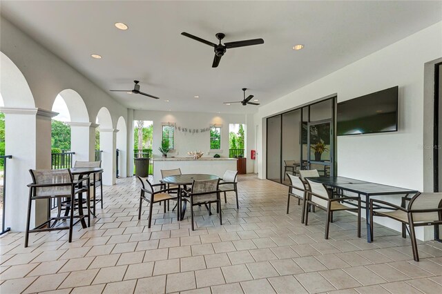3504 Big Sky Way, Bradenton, FL 34211 - view of patio featuring outdoor dining space, a ceiling fan, and a bar