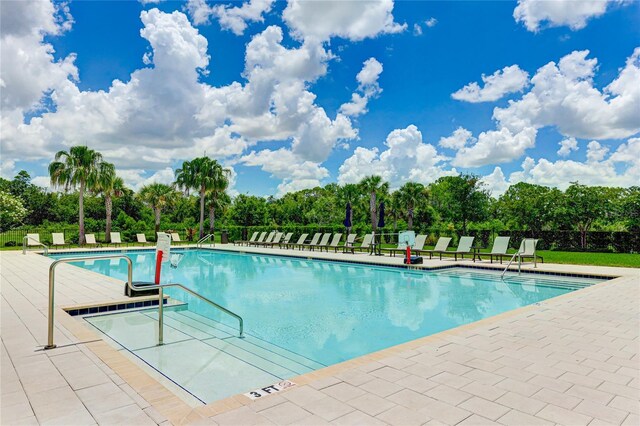 3504 Big Sky Way, Bradenton, FL 34211 - community pool featuring view of wooded area and a patio