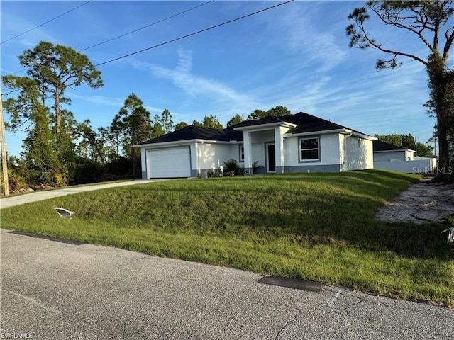 2906 18th St SW, Lehigh Acres, FL 33976 - single story home with stucco siding, a garage, a front lawn, and driveway