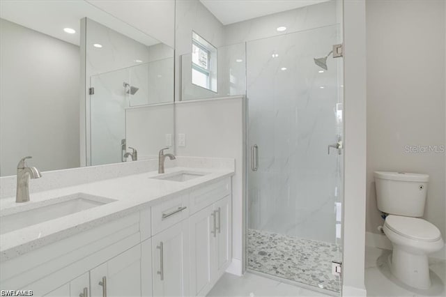 2906 18th St SW, Lehigh Acres, FL 33976 - full bathroom with a marble finish shower, toilet, double vanity, and marble finish flooring