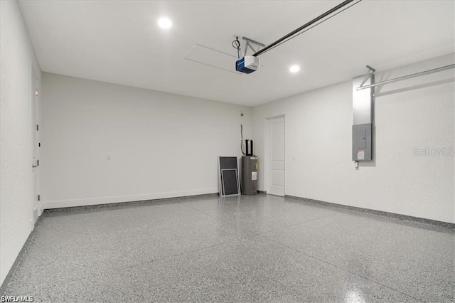 2906 18th St SW, Lehigh Acres, FL 33976 - garage featuring electric panel, water heater, a garage door opener, baseboards, and recessed lighting