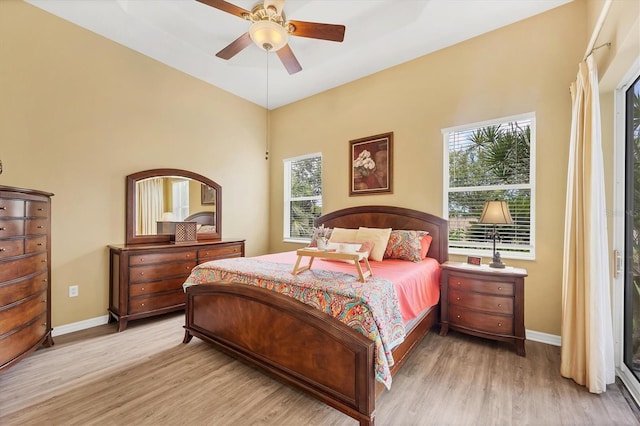 2085 Mattamy Ct, Venice, FL 34292 - bedroom with wood finished floors, a ceiling fan, and a high ceiling
