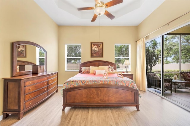 2085 Mattamy Ct, Venice, FL 34292 - bedroom featuring access to exterior, light wood finished floors, and a ceiling fan