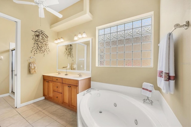 2085 Mattamy Ct, Venice, FL 34292 - full bathroom with a jetted tub, double vanity, a ceiling fan, and tile patterned floors
