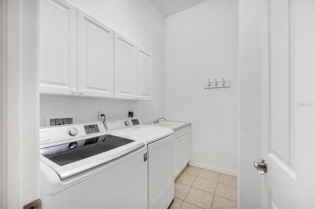 2085 Mattamy Ct, Venice, FL 34292 - laundry room featuring cabinet space, washer and dryer, and light tile patterned floors
