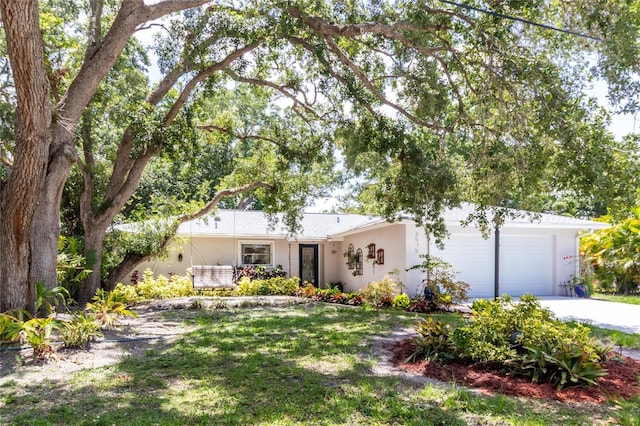 2515 Huntington Ave, Sarasota, FL 34232 - ranch-style house featuring an attached garage, driveway, and stucco siding