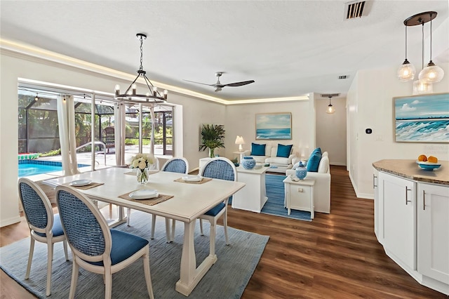 2515 Huntington Ave, Sarasota, FL 34232 - dining space with dark wood finished floors, ceiling fan, and baseboards
