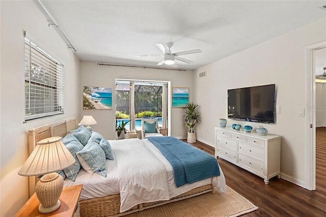 2515 Huntington Ave, Sarasota, FL 34232 - bedroom featuring dark wood finished floors, access to exterior, baseboards, and a ceiling fan
