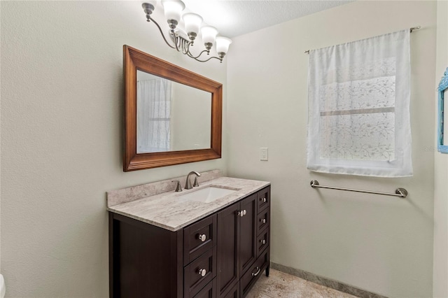 2515 Huntington Ave, Sarasota, FL 34232 - bathroom with vanity and a chandelier