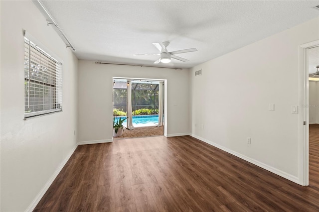 2515 Huntington Ave, Sarasota, FL 34232 - unfurnished room featuring ceiling fan, wood finished floors, baseboards, and a textured ceiling