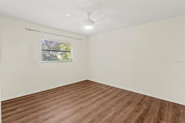 2515 Huntington Ave, Sarasota, FL 34232 - spare room with wood finished floors, baseboards, and a ceiling fan
