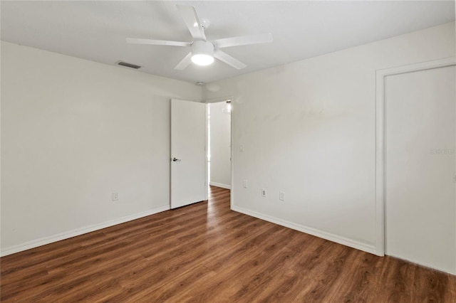 2515 Huntington Ave, Sarasota, FL 34232 - empty room with wood finished floors, ceiling fan, and baseboards
