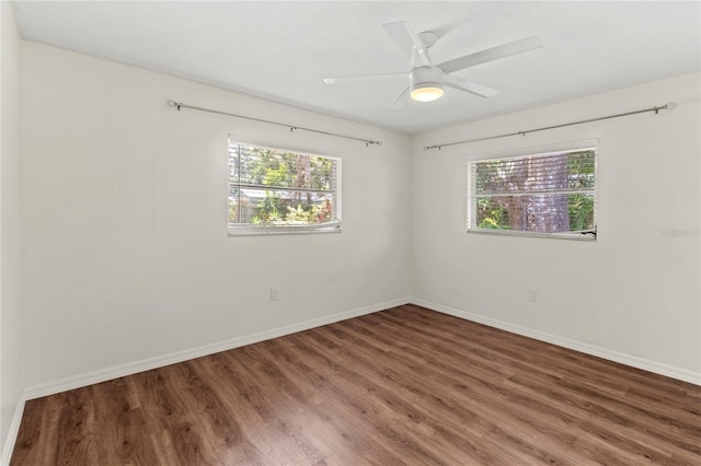 2515 Huntington Ave, Sarasota, FL 34232 - unfurnished room with healthy amount of natural light, wood finished floors, and baseboards