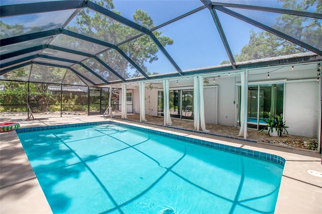 2515 Huntington Ave, Sarasota, FL 34232 - outdoor pool featuring a ceiling fan, a patio area, and glass enclosure
