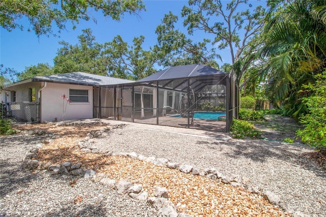 2515 Huntington Ave, Sarasota, FL 34232 - back of house with an outdoor pool, a patio area, a lanai, and stucco siding