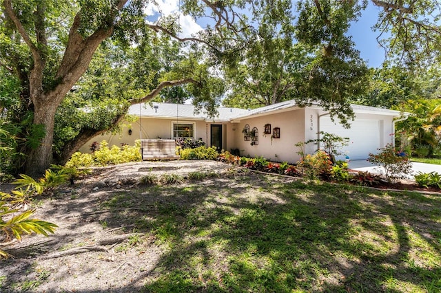 2515 Huntington Ave, Sarasota, FL 34232 - view of front facade featuring a garage, stucco siding, and concrete driveway