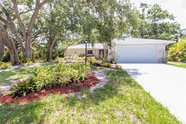 2515 Huntington Ave, Sarasota, FL 34232 - ranch-style home with a garage, driveway, and stucco siding