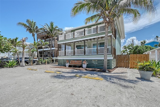 1103 Shore View Dr, Englewood, FL 34223 - view of front facade with a gate and uncovered parking
