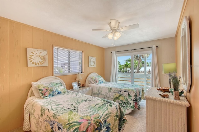 1103 Shore View Dr, Englewood, FL 34223 - bedroom featuring carpet, wood walls, and a ceiling fan