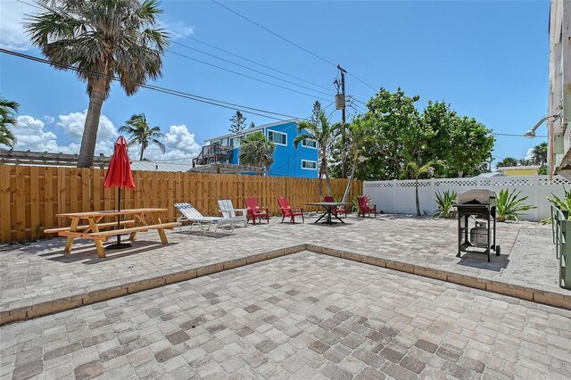 1103 Shore View Dr, Englewood, FL 34223 - fenced backyard featuring a patio area