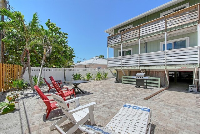 1103 Shore View Dr, Englewood, FL 34223 - fenced backyard with a patio and outdoor dining space