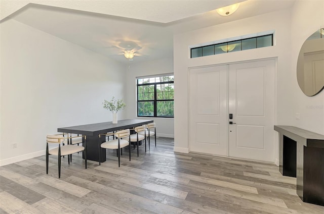 2546 Malibu Ln, North Port, FL 34286 - entryway featuring light wood finished floors, ceiling fan, and baseboards