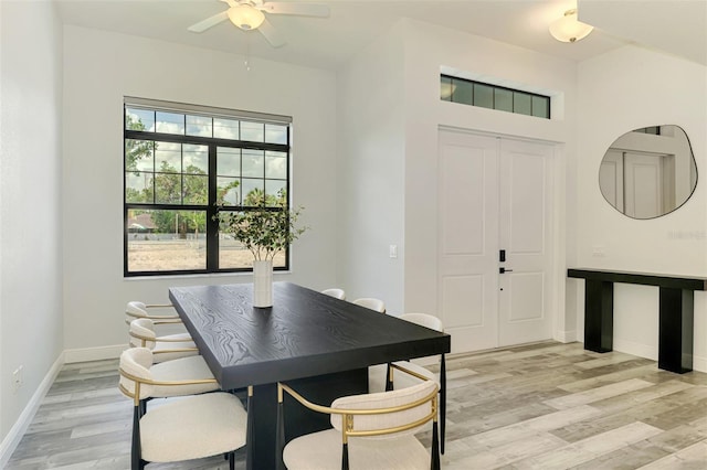 2546 Malibu Ln, North Port, FL 34286 - dining room featuring light wood-style floors, a ceiling fan, and baseboards
